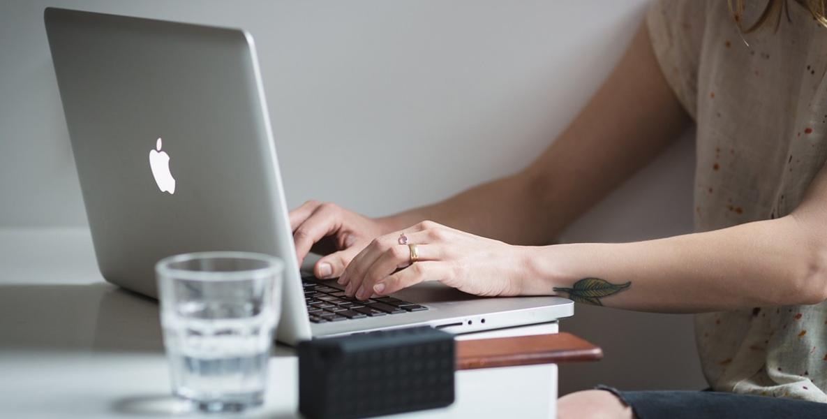 Woman typing on laptop