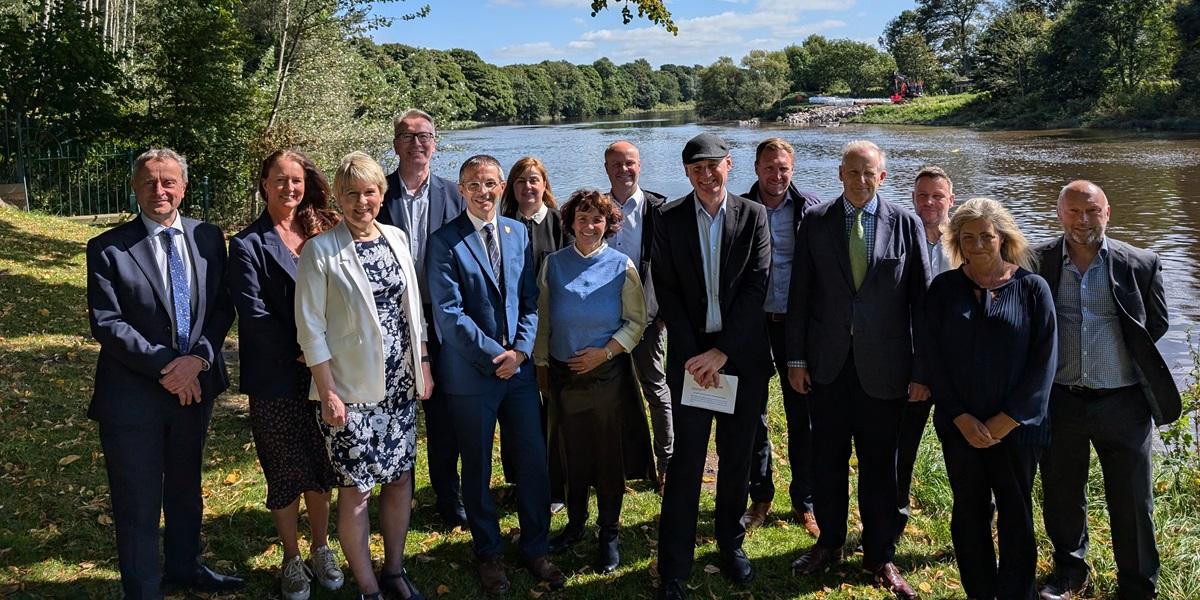 Old tram bridge demolished with key stakeholders in foreground 