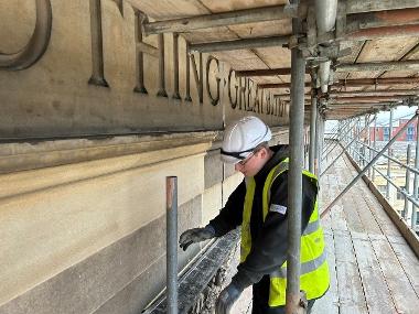 A young apprentice working in construction on the Harris Museum project